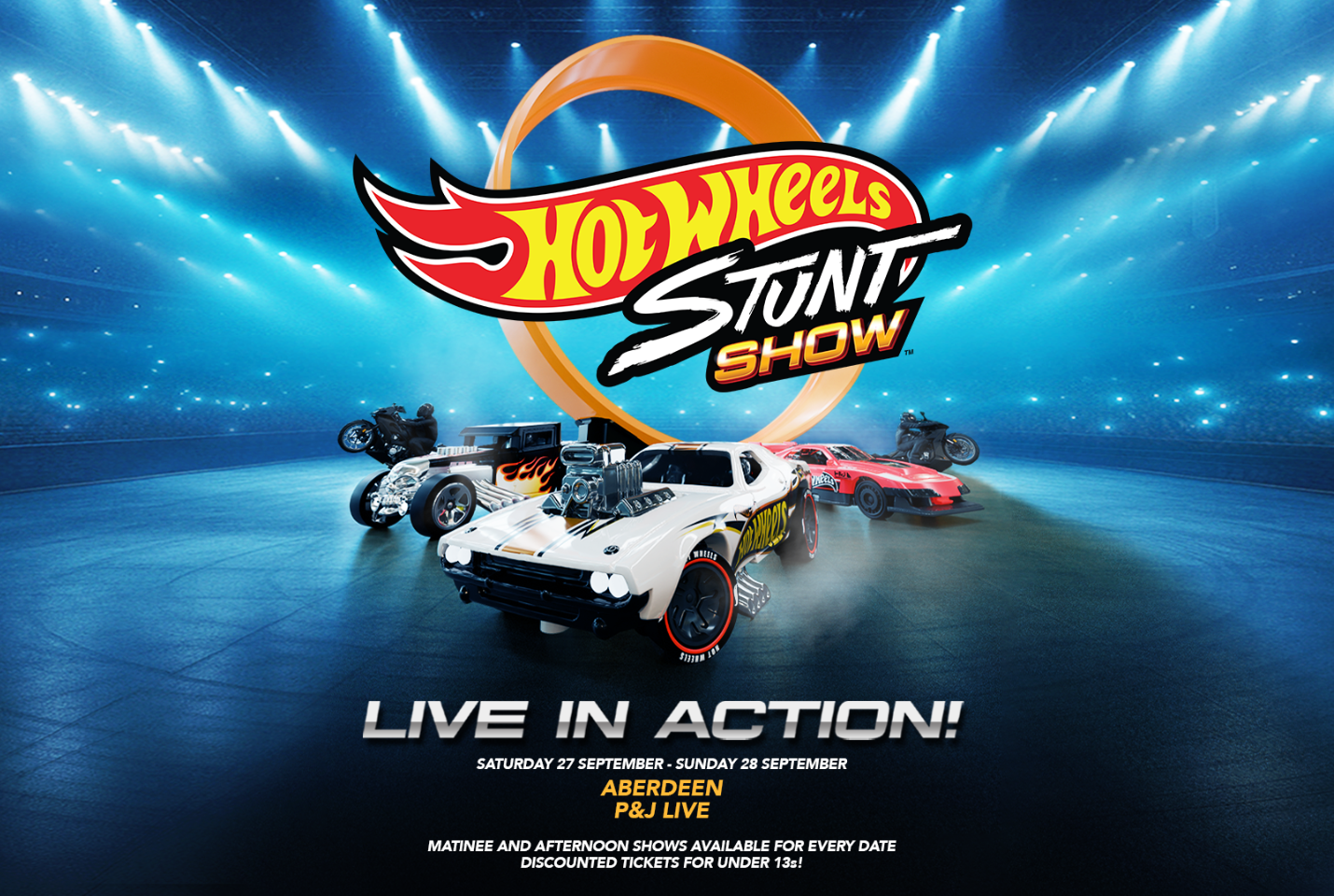Some of the cars and bikes used in the Hot Wheels Stunt Show sitting in an arena.